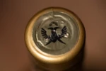 Логотип на колпачке коньяка Орран Черри 6 лет 0.5л